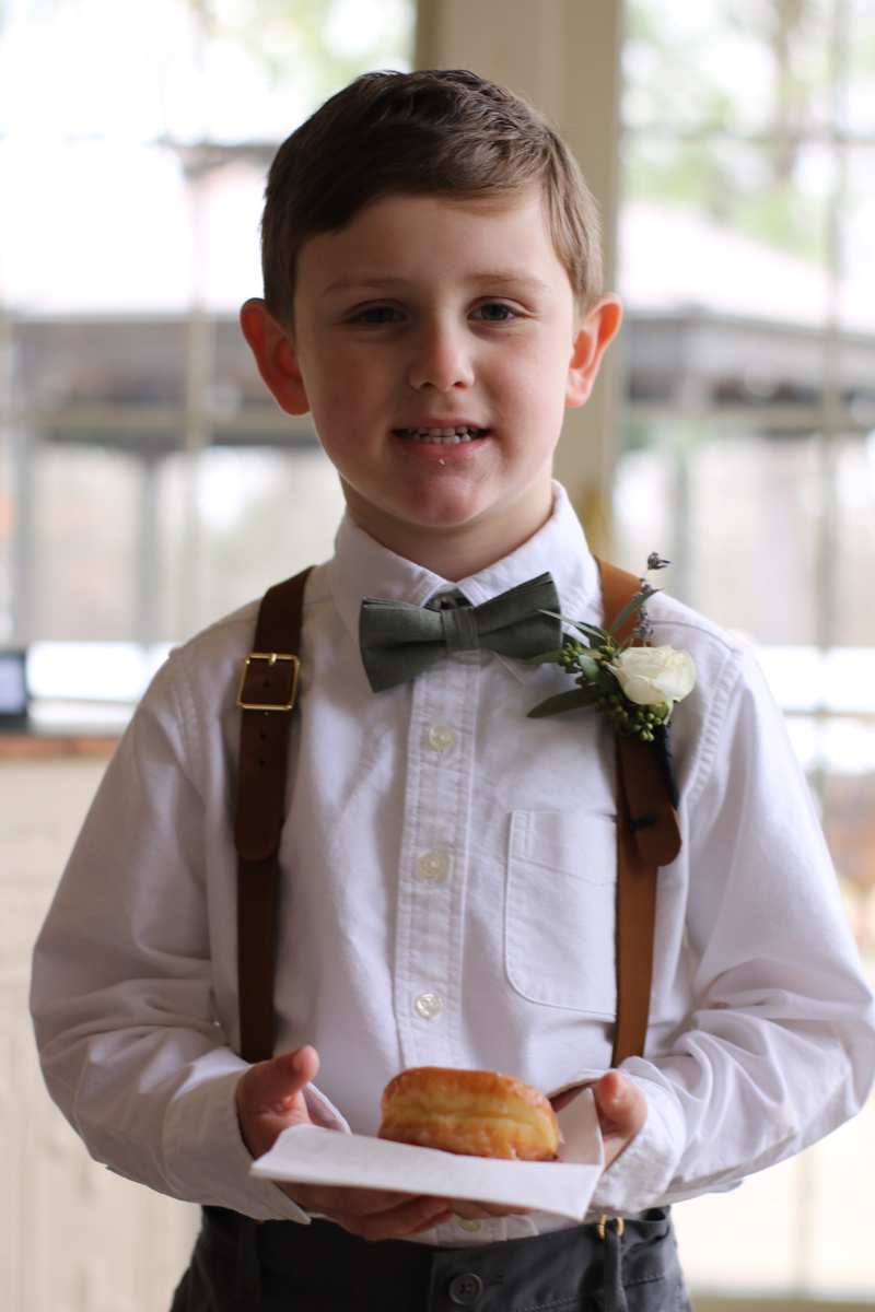 the ringbearer at said wedding, bearing a ring of dough, Feb.